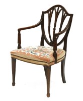 Lot 204 - A Hepplewhite period mahogany elbow chair