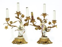 Lot 192 - A pair of gilt bronze three-branch candelabra