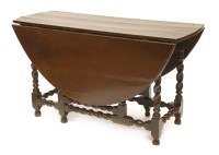 Lot 258 - An oak gateleg table