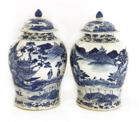 Lot 235 - A pair of Chinese blue and white baluster vases and covers