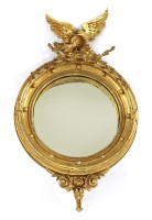 Lot 528 - A George III giltwood convex wall mirror