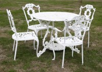 Lot 549 - A painted metal garden table and four chairs