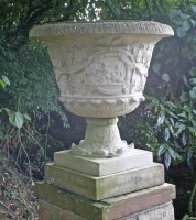 Lot 540 - A pair of composition stone urns