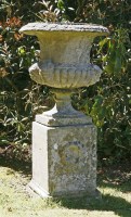 Lot 547 - A composition stone urn and pedestal