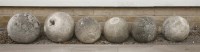 Lot 553 - Six composition stone ball-shaped finials