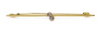 Lot 336 - A gold two stone crossover diamond bar brooch