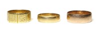 Lot 340 - An 18ct gold flat section wedding ring
