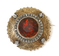 Lot 282 - A French late 19th century gold Madeira citrine and diamond shield brooch