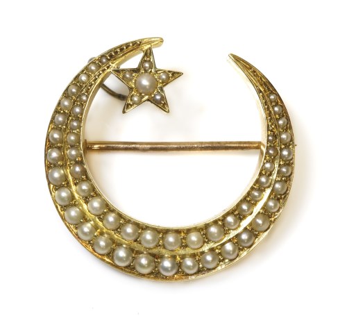 Lot 302 - A Victorian gold split pearl crescent and star brooch
