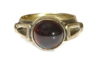 Lot 281 - A gold single stone cabochon garnet ring