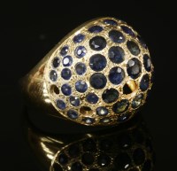 Lot 180 - A Continental gold sapphire set bombé ring