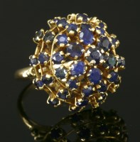 Lot 203 - A Continental gold sapphire domed cluster ring