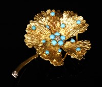 Lot 174 - An 18ct gold diamond and turquoise flower brooch
