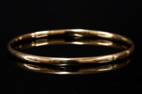 Lot 557 - A 9ct gold court section bangle