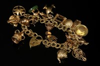 Lot 563 - A 9ct gold double curb link charm bracelet