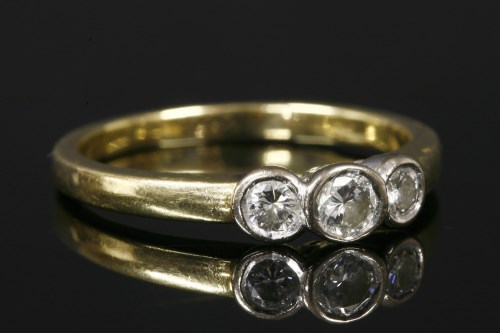 Lot 25 - An 18ct gold three stone diamond ring