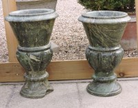 Lot 699 - A pair of green marble garden urns