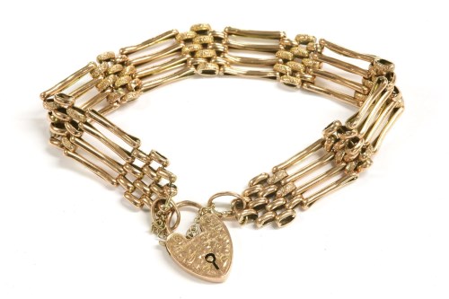 Lot 79 - A gold four row bar link gate bracelet