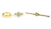 Lot 71 - A gold peridot and diamond cluster ring