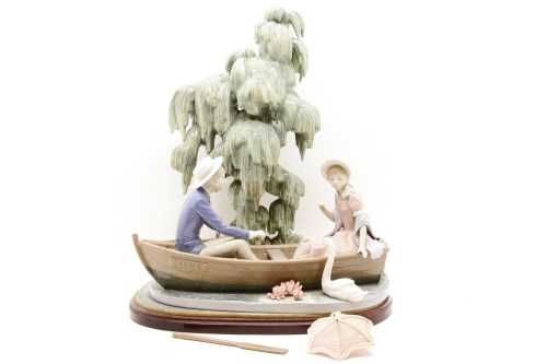 Lot 454 - A large Lladro group of a couple in a rowing boat