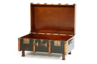 Lot 654 - A 'By Land & By Sea' ebonised and wooden bound trunk table