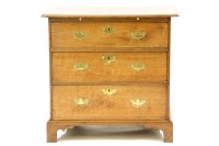 Lot 670 - A small oak chest of three drawers