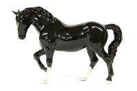 Lot 268 - A Beswick black cantering mare