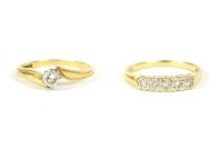 Lot 30 - An 18ct gold single stone diamond crossover ring