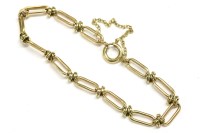 Lot 51 - A 9ct gold fetter and knot bracelet