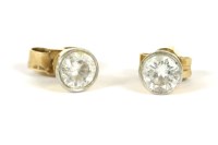 Lot 6 - A pair of 18ct gold single stone diamond stud earrings