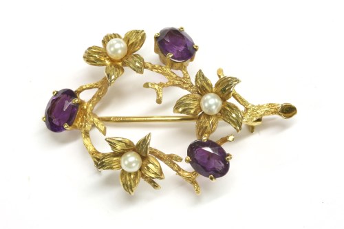 Lot 11 - A 9ct gold amethyst and cultured pearl spray circle brooch
