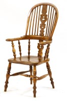 Lot 561 - A 19th century club arm Windsor chair
