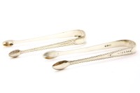 Lot 149 - Two pairs of George III silver sugar tongs