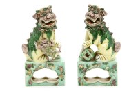 Lot 228 - A pair of 19th century Chinese porcelain famille vert decorated temple lions