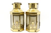 Lot 485 - A pair of brass lamps