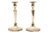 Lot 219 - A pair of Russian silver table candlesticks