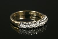 Lot 589 - A 9ct gold diamond set half eternity ring