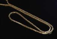 Lot 279 - A 9ct gold continuous square section Byzantine chain