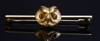Lot 96 - A Continental gold and chrysoberyl owl head bar brooch