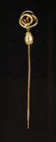 Lot 88 - A Continental gold and citrine serpent or snake form stickpin