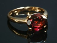 Lot 371 - An Italian rose gold single stone garnet ring