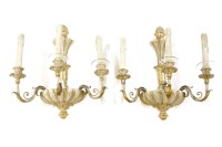 Lot 348 - A pair of cream and gilt-painted three-branch wall lights