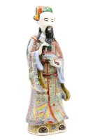 Lot 352 - A Chinese famille rose house God figure
