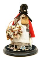 Lot 338 - A black pedlar doll under glass dome