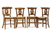 Lot 516 - A set of four fruitwood and rush seated kitchen chairs