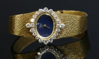 Lot 314 - A ladies' 18ct gold Topaz London mechanical diamond set bracelet watch