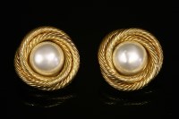 Lot 520 - A pair of Chanel gold-plated simulated pearl circular clip-on earrings
