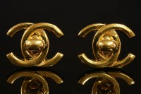 Lot 519 - A pair of Chanel gold-plated double 'C' turnlock clip-on earrings