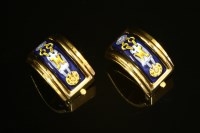 Lot 512 - A pair of Hermès gold-plated enamel cuff earrings