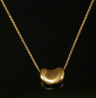 Lot 374 - A gold bean pendant by Tiffany